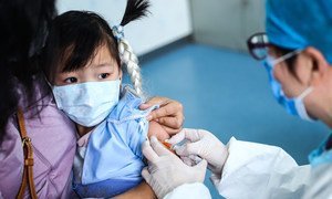 A 3-year-old girl receives a vaccine shot at a community health centre in Beijing, China.