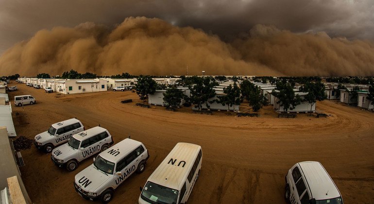 A sand storm, known locally as a haboob, builds up over a UN compound in northern Darfur in Sudan. 