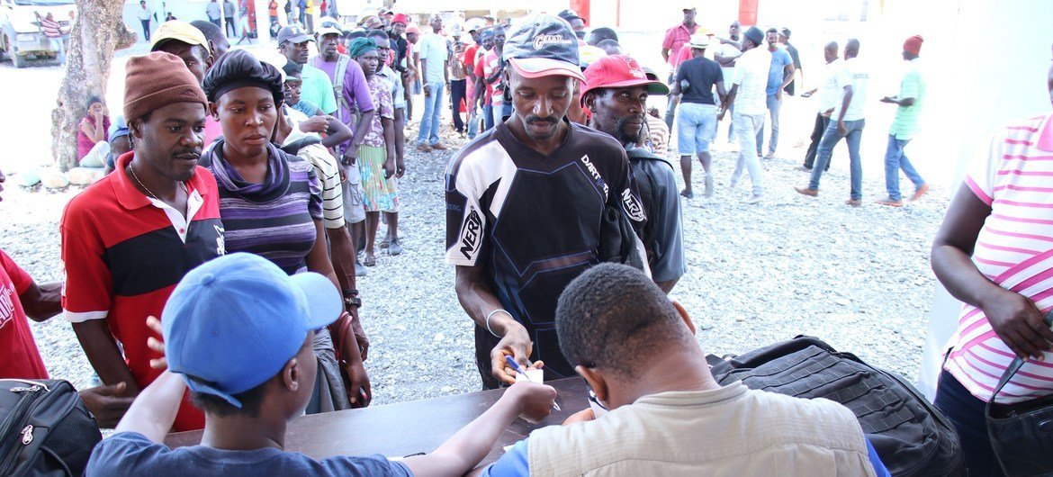 Haitians line up for food assistance from WFP in Chansolme, north-east department of Haiti.