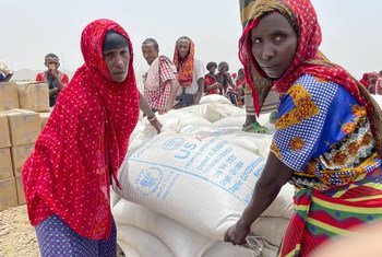 Women in the Afar region of Ethiopia receive emergency food assistance.