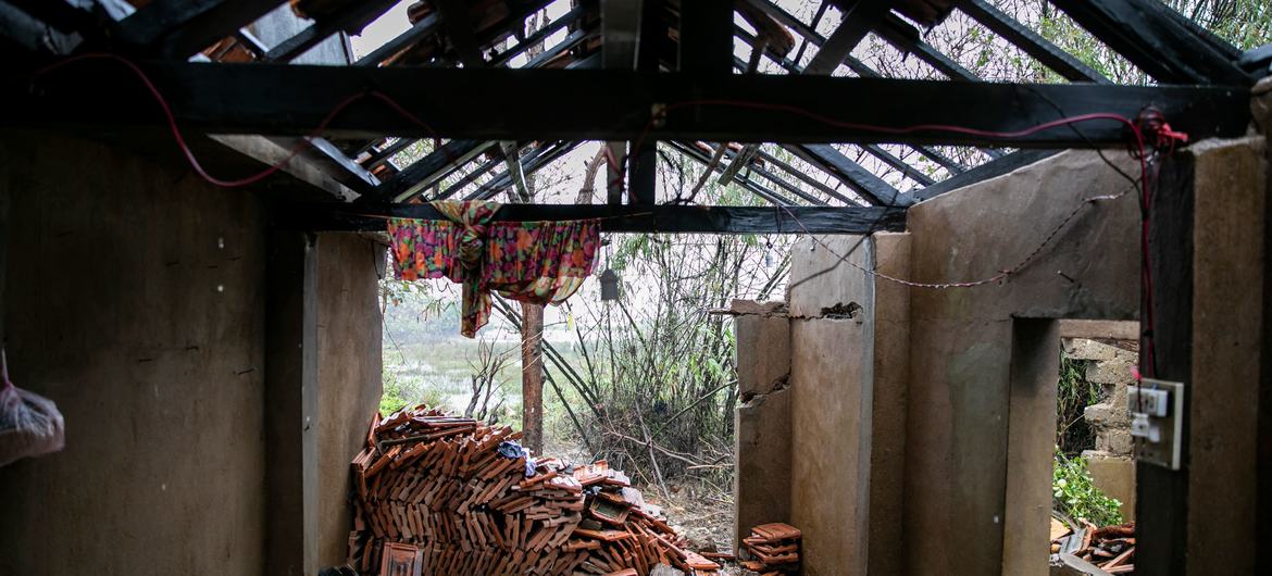 An elderly couple, hit severely by this year's storm season. They recount their harrowing experience of flood waters rising in their simple one-room home.