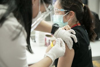 Health workers receive the COVID-19 vaccine in San Juan City, Metro Manila.