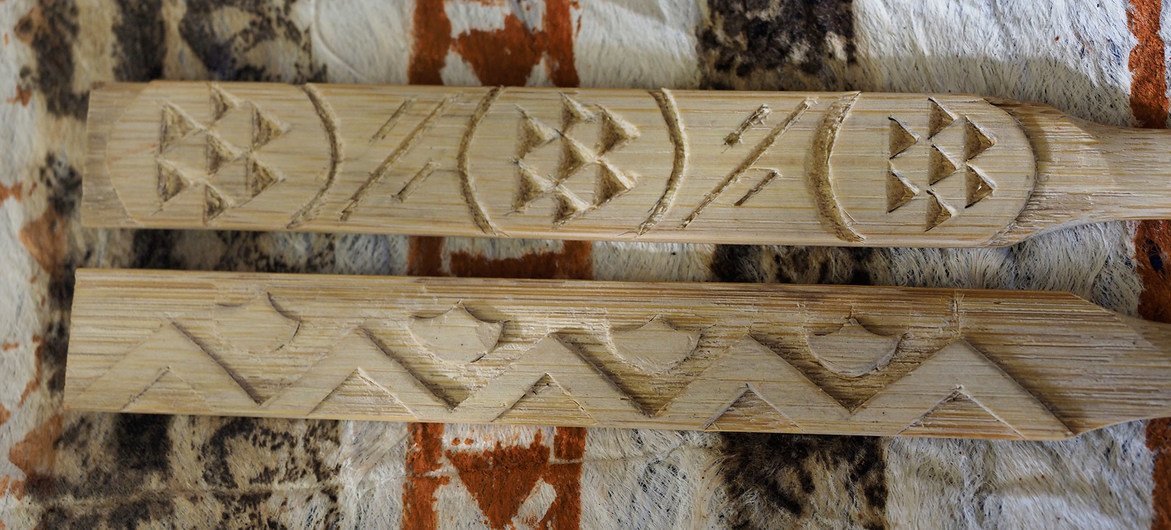 Wooden hohoa are used to flatten and then imprint kapa cloth.