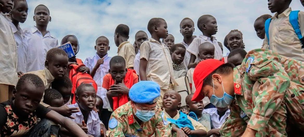 Vietnamese peacekeepers serving with the UN mission in South Sudan plant a sapling as part of a project with local youth. 