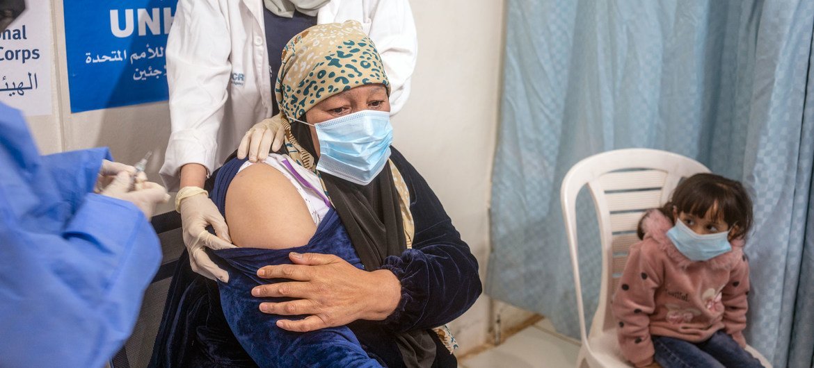 A Syrian refugee receives a COVAX-supplied COVID-19 vaccine in Za’atari refugee camp in Jordan.  