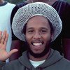 Jamaican reggae artist and musician Ziggy Marley pledges his support for 'Say Yes for Children' while visiting UN Headquarters, in July 2001.