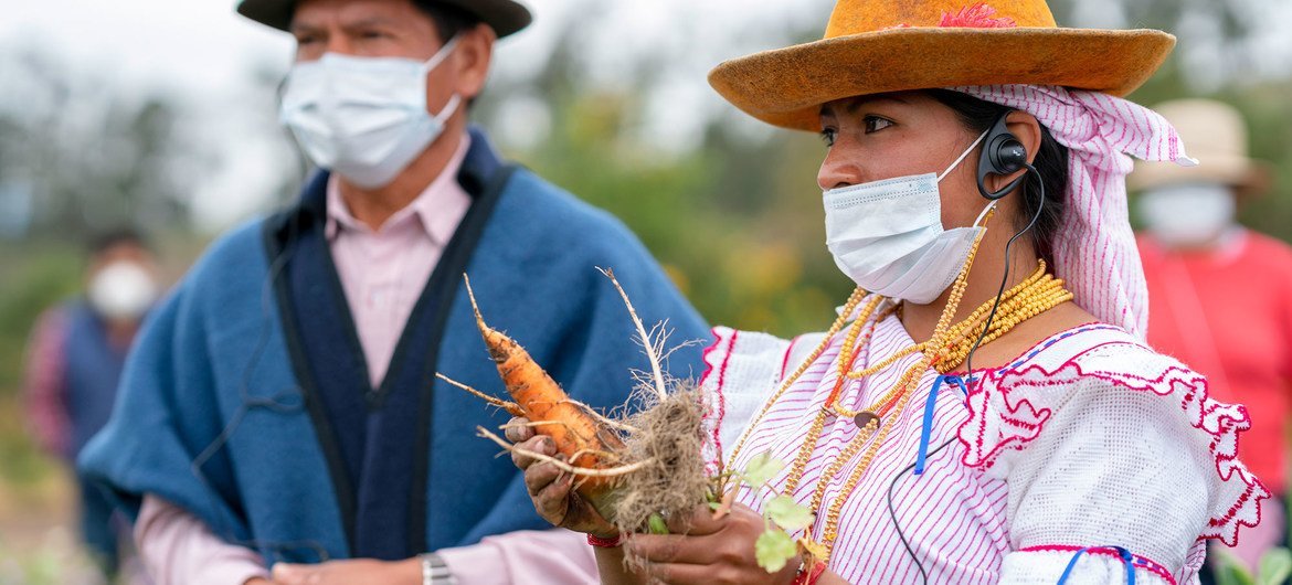 A young indigenous leader is pictured on a farm in Imbabura province, Ecuador. She is a beneficiary of WFP support for small farmer associations, of which 64% are women, as providers of fresh food.