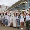 Women protesters hold hands in solidarity over the disputed presidential election in Belarus.