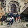 Omar (17), far right on second row, and other unaccompanied migrant boys at an abandoned church in Sicily, Italy. Most of them were transferred without a choice to this very small village.