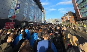 Long lines of participants wait to pass security and enter the Blue Zone at the Scottish Event Campus, at the COP26 Climate Conference in Glasgow, Scotland.