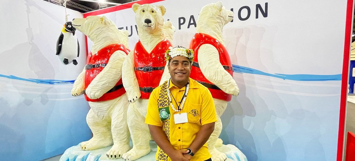 Bernard Ivekia, a Tuvalu student, poses for a photo at his country's COP26 pavilion at the climate conference in Glasgow, Scotland.