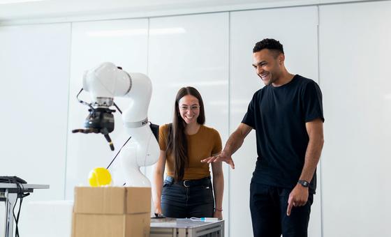 Engineers work with medical robotic equipment.