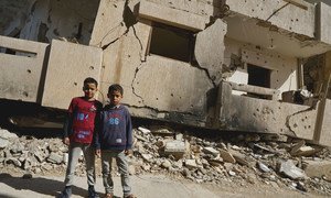 Young boys stand in front of a destroyed building in Benghazi Old Town in Libya. (file)