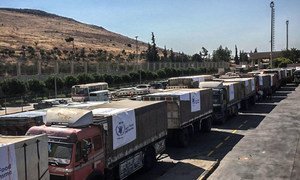 Trucks carrying food assistance cross the Turkish border into Syria. (file photo)