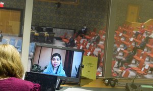 A screen in an interpreter's booth shows Malala Yousafzai addressing the UN Security Council meeting on Afghanistan, on 9 September, 2021.