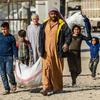Families fleeing escalating violence in northeast Syria.