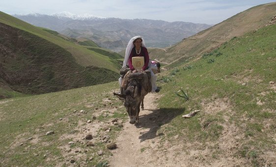 Najeeba has been working for years as a health worker in north-east Afghanistan. Community leaders like her make all the difference when myth and misinformation stop children being vaccinated. (April 2004).