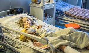 Shelling killed six-year-old Milana's mother. She is now recovering after surgery at a children's hospital in Kyiv, Ukraine.