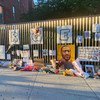 An impromptu memorial for George Floyd, who was killed after being restrained by police, has been set up in Harlem, New York City. 