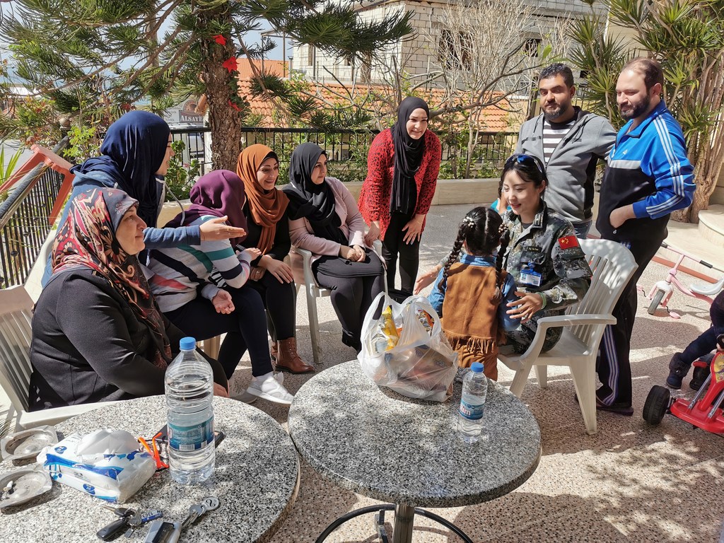 Major Xin Yuan is imparting knowledge of landmines and explosive remnants of war for local women and girls 