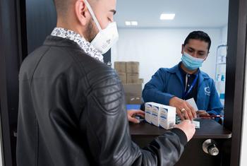 A man receives his HIV medication during the COVID-19 pandemic in Colombia.