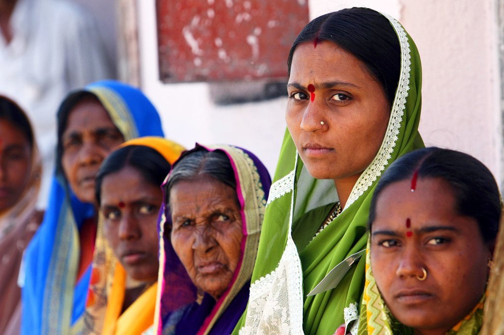 A group of women stand together in Aurangabad, India.