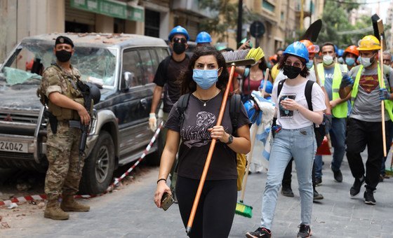 Community supporters clean up the aftermath of the catastrophic explosion in the area of Gemmayze, in Beirut, Lebanon.