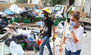 Community supporters clean up the aftermath of the catastrophic explosion in the area of Gemmayze, in Beirut, Lebanon.
