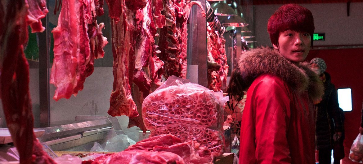 A meat stall in a market in Beijing, China.