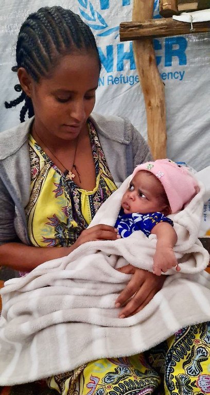 Selam with her daughter Maedot after giving birth safely at the Maternity Waiting Home which is supported by UNFPA at the Sabacare 4 internally displaced site in Mekelle, Tigray.