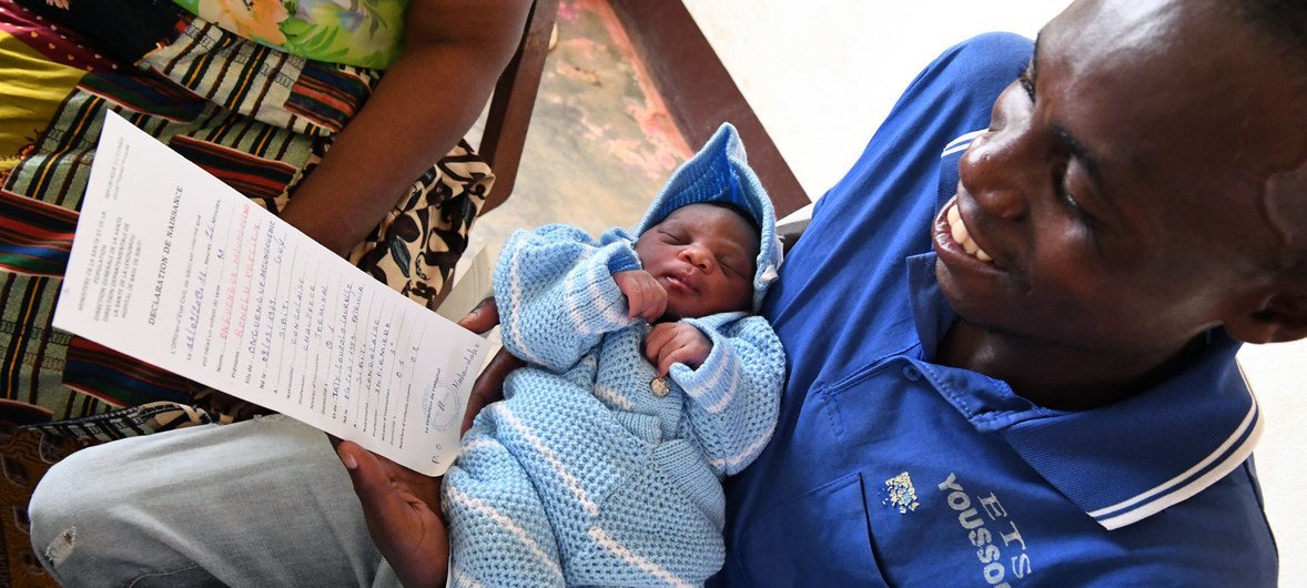 A newborn baby receives her birth certificate at a hospital in the Republic of the Congo.