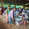 Internally displaced people receive assistance at the Myaing Gyi Ngu camp in Myanmar’s Kayin State.