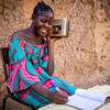 A ninth grade student follows her lessons on the radio in Mali.
