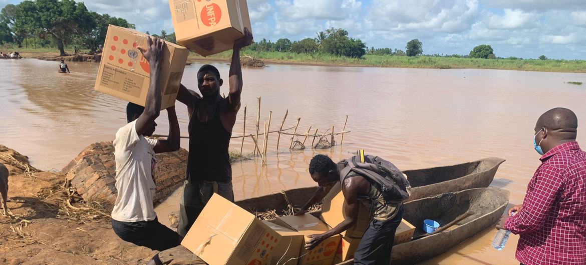 Dignity kits are transported by canoe after Tropical Storm Ana damaged roads and bridges in Zambezia Province, Mozambique.