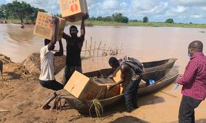 Dignity kits are transported by canoe after Tropical Storm Ana damaged roads and bridges in Zambezia Province, Mozambique.