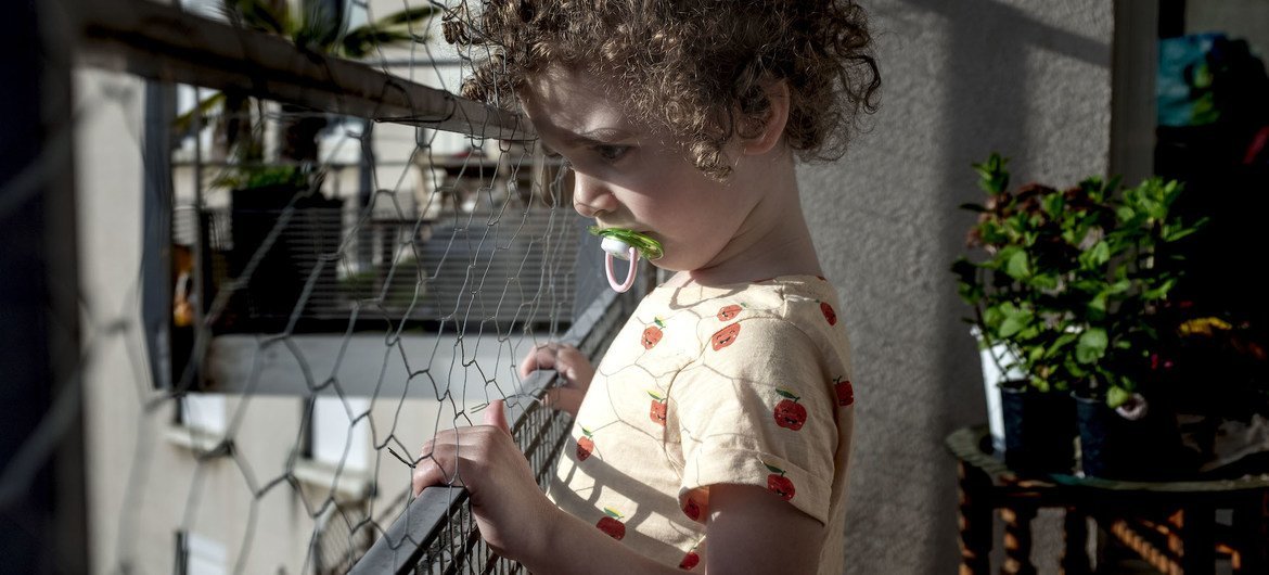 A three-year-old child at home in Lyon, France, during a COVID-19 lockdown.