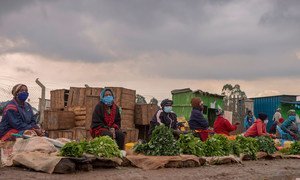 Kenyan market vendors practice social distancing to prevent the spread of COVID-19.