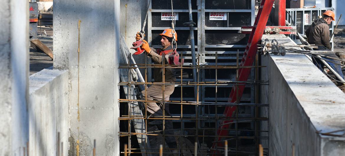 Men work on the construction site of a grain processing factory in Kyiv Oblast of central Ukraine. (file)