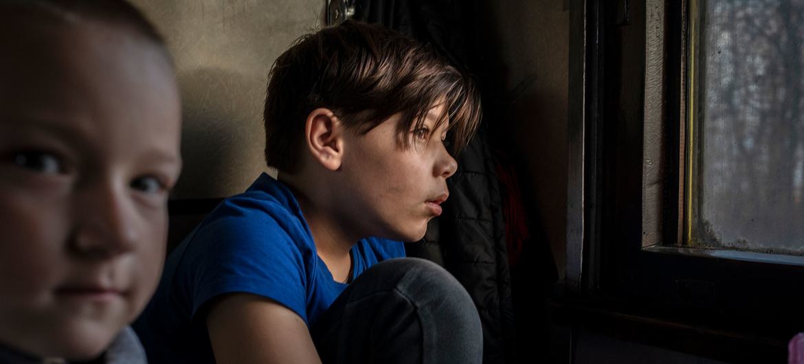 Children wait on a train in Ukraine to be evacuated to Poland in early April 2022.