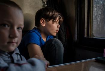Children wait on a train in Ukraine for evacuation to Poland in early April 2022.