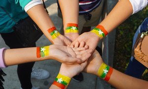 A group of people on the streets of Yangon show their support for Myanmar.