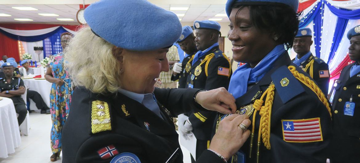 Nine police officers from Liberia receive the prestigious UN medal for their efforts to build enduring peace in the world's youngest nation, South Sudan.