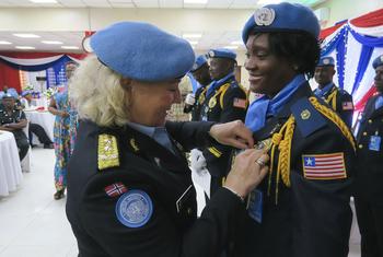 Nine police officers from Liberia receive the prestigious UN medal for their efforts to build enduring peace in the world's youngest nation, South Sudan.