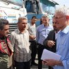 The UN Humanitarian Coordinator, Mark Lowcock (r), meets with a group of Syrian drivers on the Turkish side of the two countries' common border (file photo).