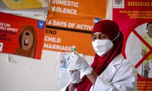A healthcare worker prepares a COVID-19 vaccine at a hospital in Mogadishu, Somalia.