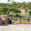 Families fetch water from a UNICEF supported well in Kilte Awlalo in the Tigray region of Ethiopia.