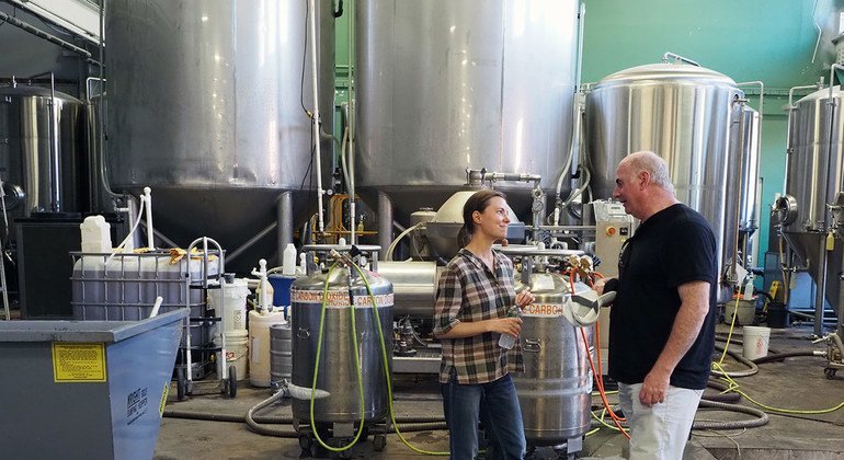 Kevin Cassidy, the Director of the ILO Office for the United States (right) meets Emily Sorlien, of the Rhode Island-based Whalers Brewing Company .