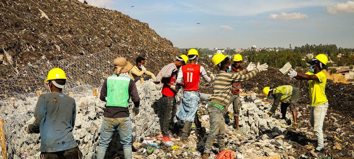 Construction workers build gabion structures at the Koshe landfill in Addis Ababa, Ethiopia. A total of 162 gabions were built to stabilize the site and control erosion to prevent further landslides.