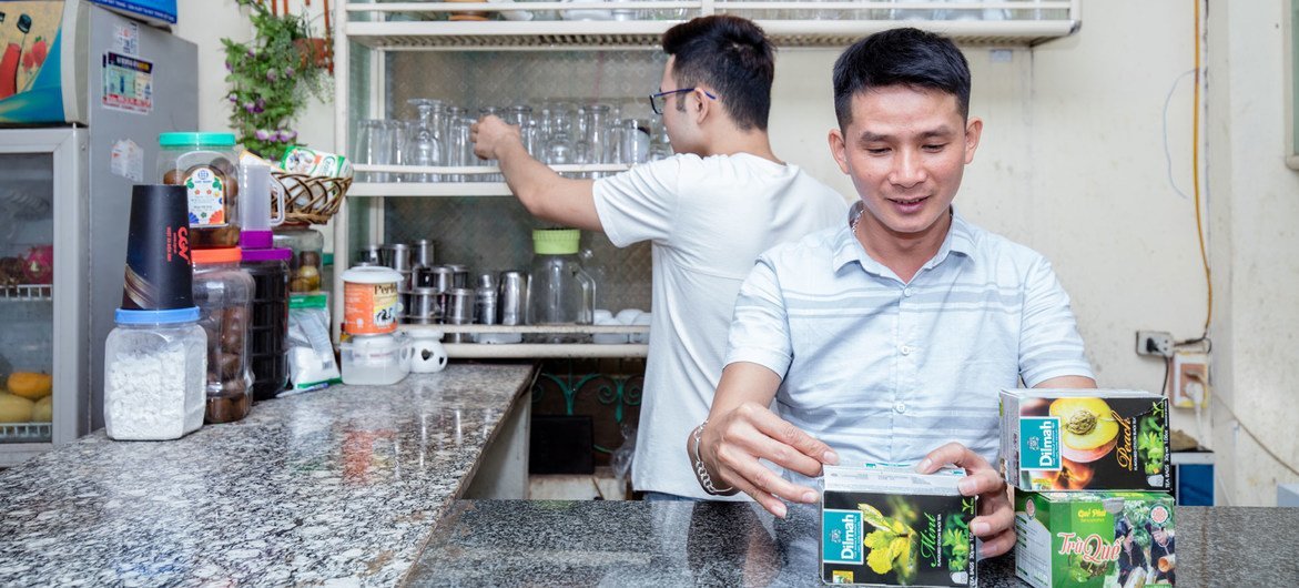 Nguyen Trong Hung (right) opened a cafe for the LGBT community in Son La, Viet Nam.