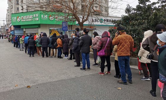 Residents in east China's Nanjing city line up to buy masks.